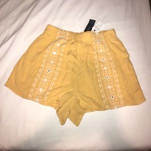 BNWT yellow flowy shorts